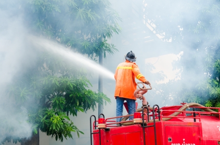 SINGBURI - JUNE 13 : Practicing fire protection plan and chemicals prepare for the officer about the Disaster Management on June 13, 2013 in Singburi, Thailand.のeditorial素材