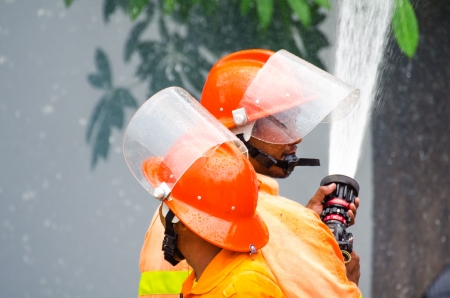 SINGBURI - JUNE 13 : Practicing fire protection plan and chemicals prepare for the officer about the Disaster Management on June 13, 2013 in Singburi, Thailand.のeditorial素材