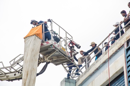 SINGBURI - JUNE 13 : Practicing fire protection plan and chemicals prepare for the officer about the Disaster Management on June 13, 2013 in Singburi, Thailand.のeditorial素材