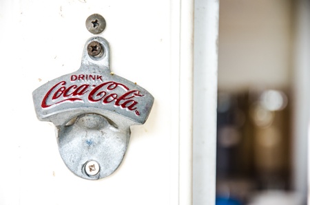 SINGBURI, THAILAND - JULY 20 : Bottle opener  with the logo of Coca Cola on July 20, 2013 in Singburi, Thailand. It is a carbonated soft drink sold in stores and restaurants in Thailand.のeditorial素材