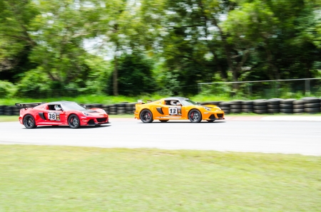 CHOUN BURI - AUGUST 18  Unidentified driver with  Lotus racing caron display at the Thailand Super Series 2013 Race 4 on August 17, 2013 at the Bira International Circuit Pattaya, Thailand のeditorial素材