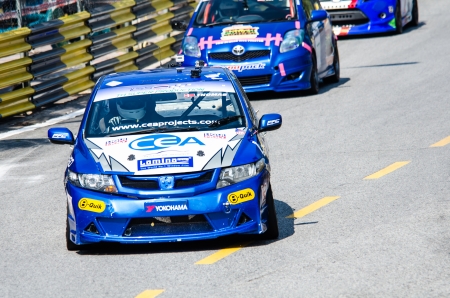 CHON BURI - DECEMBER 22:  Anders M. with Mazda car on display at the Bangsaen Thailand Speed Festival 2013 Race 8 on December 22, 2013 at the Bangsaen street circuit , Thailand.のeditorial素材