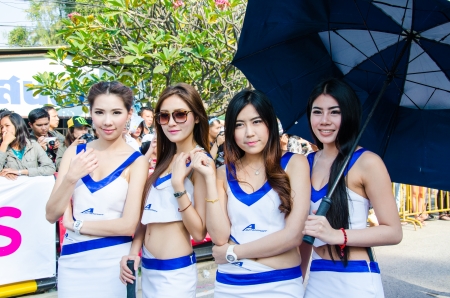 CHON BURI - DECEMBER 22:  Unidentified model with racing car on display at the Bangsaen Thailand Speed Festival 2013 Race 8 on December 22, 2013 at the Bangsaen street circuit, Thailandのeditorial素材