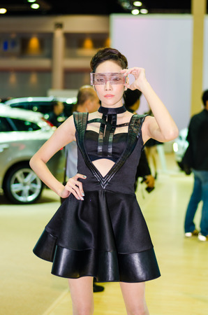 BANGKOK - MARCH 25: Unidentified model with Isuzu X-Series on display at The 35th Bangkok International Motor Show on March 25, 2014 in Bangkok, Thailand.のeditorial素材