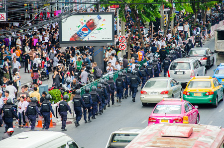 BANGKOK - MAY 24  Riot police stand guard on Major Cineplex Ratchayothin Bangkok during a violent anti-Military coup on May 24, 2014 in Bangkok, Thailand のeditorial素材