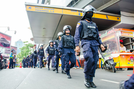 BANGKOK - MAY 24  Riot police stand guard on Major Cineplex Ratchayothin Bangkok during a violent anti-Military coup on May 24, 2014 in Bangkok, Thailand のeditorial素材