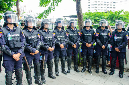 BANGKOK - MAY 24  Riot police stand guard on Major Cineplex Ratchayothin Bangkok during a violent anti-Military coup on May 24, 2014 in Bangkok, Thailand のeditorial素材