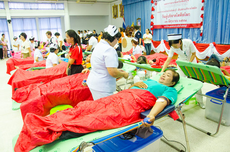 SINGBURI - JUNE 12 : Unidentified blood donors in World Blood Day 2014 at Sing Buri Red Cross office on June 12, 2014 in Singburi, Thailand.のeditorial素材