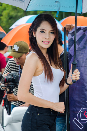CHON BURI - JULY 5  Unidentified model with racing car on display at the Thailand Super Series 2014 Race 3 on July 5, 2014 at the Bira International Circuit Pattaya, Chon Buri Thailand のeditorial素材