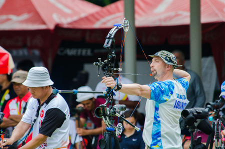 BANGKOK -MARCH 19: Unidentified archers in a row and shootin 2015 Asia Cup-World Ranking Tournament...