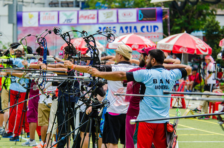 BANGKOK -MARCH 19: Unidentified archers in a row and shootin 2015 Asia Cup-World Ranking Tournament (stage II) at Hua Mak Sports Complex on March 19, 2015 in Bangkok, Thailand.のeditorial素材