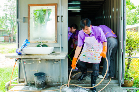 SINGBURI - APRIL 3 : Volunteers was cleaning public toilet, in order to promote a shared clean toilet, April 3, 2015, Singburi, Thailand.のeditorial素材