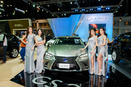 BANGKOK - DECEMBER 1: Unidentified model  with Lexus GS 300h car on display at the 32nd Thailand International Motor Expo 2015 on December 1, 2015 in Nonthaburi, Thailand.のeditorial素材