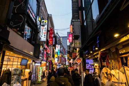 SEOUL - JANUARY 30: Korean people and tourists walking shopping at Myeongdong Market shopping street It is popular and latest fashion center of Korea on January 30, 2016 at Myeongdong Market in Seoul, South Korea.のeditorial素材