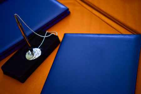 Blue notebook for signing agreement on cooperation.の写真素材