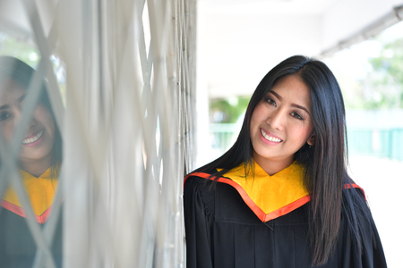 Portrait of asian cute women graduate of university.の写真素材