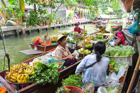 BANGKOK - JULY 29 : Farmer selling fruit vegetable and food on boats at Khlong Lat Mayom floating...