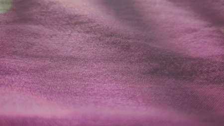 Fabric on a pink background.の写真素材