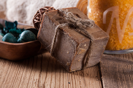 Cleaning products on wooden table. Soap, towel and moreの写真素材