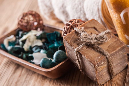 Cleaning products on wooden table. Soap, towel and moreの写真素材
