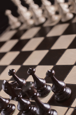 Chess pawns on the chessboard. Closeup