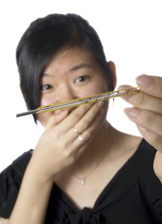 Woman holding a thermometer with white backgroundの写真素材