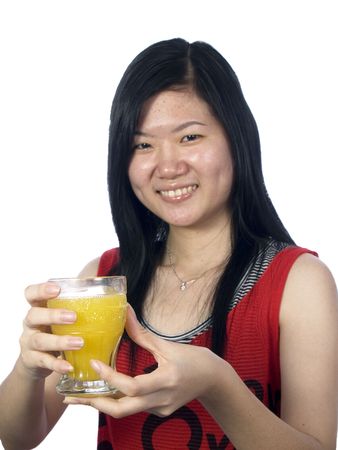 The girl shows a cup of juice with white backgroundの写真素材