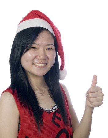 Portrait of a santa girl with hat at white backgroundの写真素材