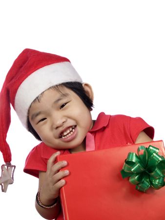 portrait of a little girl with santa hat and giftの写真素材