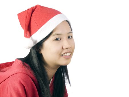 Beautiful girl in christmas clothes with white backgroundの写真素材