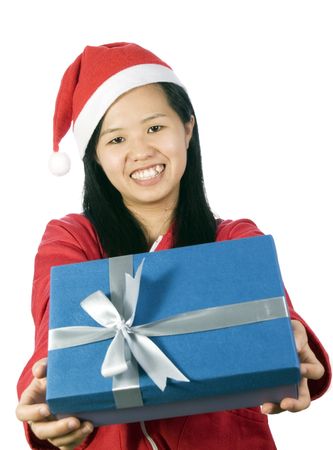 Beautiful girl in christmas clothes with a giftの写真素材