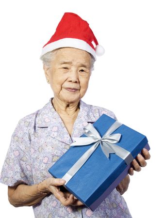 My grandmother happy smiling receiving a christmas gift.の写真素材