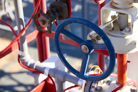 Fragments of gas processing equipment. Natural-gas processing plants purify raw natural gas by removing common contaminants such as water, carbon dioxide and hydrogen sulfide. Natural-gas processing is a complex industrial process designed to clean raw natural gas by separating impurities and various non-methane hydrocarbons.の写真素材