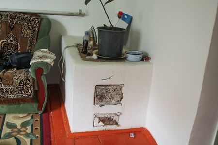 An old wood-burning stove in the house of a Kazakh farmerの写真素材