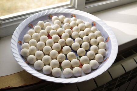 Kazakh curd dairy product - kurt on a tray.