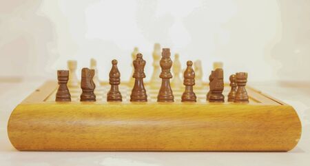 Chess on a chessboard. White background.の写真素材