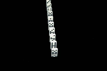 Dominoes on a black background.の写真素材