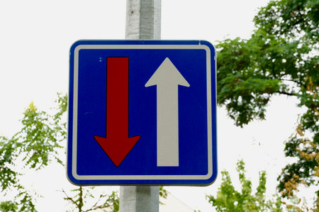 Traffic sign indicating the direction of movement in the city, close-up