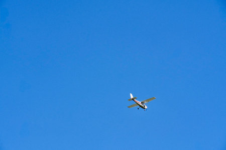 Airplane flying in the blue sky in the summer. Travel concept.