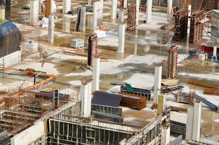 Construction site with scaffolding and building materials. Building under construction.の写真素材