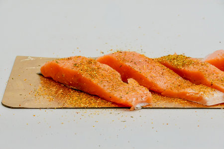 Fresh champignon mushrooms on a cutting board, ready for cookingの写真素材