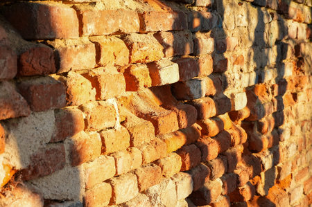 Old brick wall with sunlight in the morning. Background and texture.