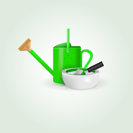 Green watering can, white bowl and shovel の写真素材
