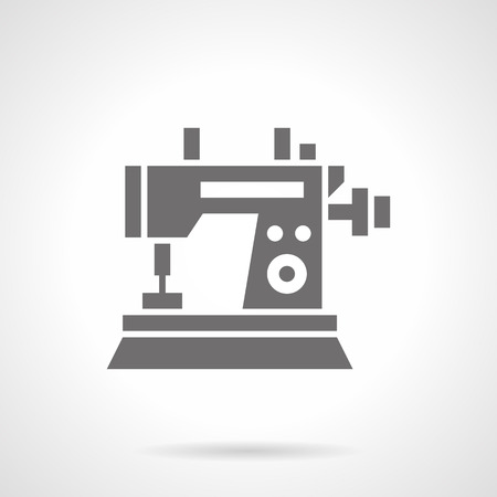 Sewing machine with small wheel. Industrial equipment for quality tailoring. Tailor profession and education. Symbolic black glyph style vector icon. Element for web design and mobile.のイラスト素材