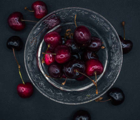 Soft cherries on a black backgroundの写真素材