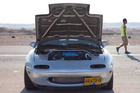 Cars on the race track and on the roads of the desertのeditorial素材
