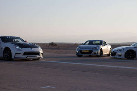 Cars on the race track and on the roads of the desert