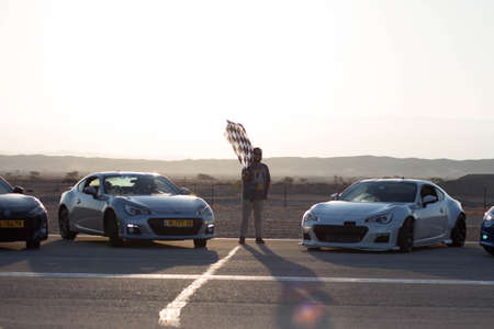 Cars on the race track and on the roads of the desert