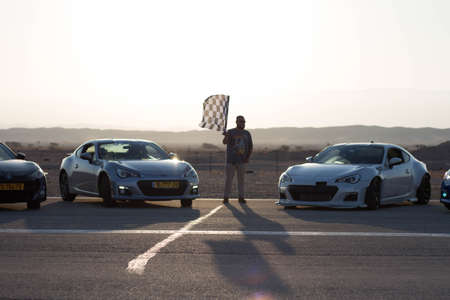 Cars on the race track and on the roads of the desert