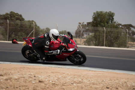 Motorcycle competition at a race track on a training day
